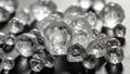 Of raw diamonds with a rough octahedral shape is displayed on a Royalty Free Stock Photo