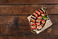 Raw dish ratatouille in pan on wooden table with border Royalty Free Stock Photo