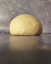Raw dough ball on a wooden table.  Close-up Royalty Free Stock Photo