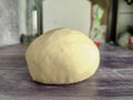 Raw dough ball on a wooden table.  Close-up Royalty Free Stock Photo