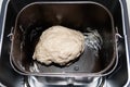 Raw dough in bread pan of electric bread maker Royalty Free Stock Photo