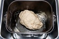 Raw dough in bread pan of electric bread maker Royalty Free Stock Photo