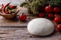 Raw dough for pizza with ingredients wooden background Royalty Free Stock Photo