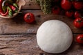 Raw dough for pizza with ingredients wooden background Royalty Free Stock Photo