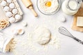 Raw dough ready for kneading on white table. Bakery ingredients, eggs, flour, butter. Shapes for making cookies.