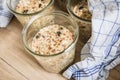 Raw dough of wholegrain bread with chia, oats, flaxseeds, sunflower and pumpkin seeds in mason glass jar for canning and prepper