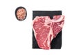 Raw dry aged wagyu porterhouse beef steak, uncooked T-bone on marble board with thyme. Isolated, white background. Royalty Free Stock Photo