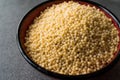 Raw Dry Organic Couscous in a Bowl