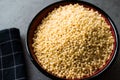 Raw Dry Organic Couscous in a Bowl