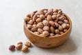 Raw Dry Pinto Beans on Marble Board with Wooden Bowl / Kidney Beans. Royalty Free Stock Photo