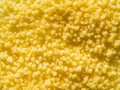 Raw dry grains couscous, close-up, top view