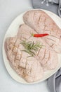 Raw duck breast with fresh spices and herbs, ready to cook food. Domestic cuisine, poultry meat Royalty Free Stock Photo