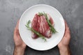 Raw duck breast in white plate Royalty Free Stock Photo