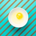 Raw egg in bowl. Minimal creative idea concept.