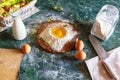 Raw egg in a handful of flour. Preparation of a spring pie