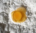 Raw egg yolk in flour Royalty Free Stock Photo