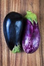 Raw eggplants over wood background Royalty Free Stock Photo