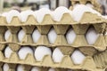 Raw eggs in carton displays for sale in a food market Royalty Free Stock Photo