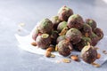 Raw energy balls with matcha tea powder on grey background. Raw vegan, vegetarian sweets. Sugar free, gluten free Royalty Free Stock Photo