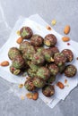 Raw energy balls with matcha tea powder on grey background. Raw vegan, vegetarian sweets. Sugar free, gluten free Royalty Free Stock Photo