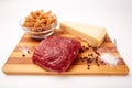 Raw Entrecote steak meat With Pepper and Salt pasta cheese On Wooden Board in a kitchen isolated on white