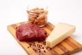 Raw Entrecote steak meat With Pepper and Salt pasta cheese On Wooden Board in a kitchen isolated on white