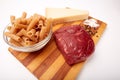 Raw Entrecote steak meat With Pepper and Salt pasta cheese On Wooden Board in a kitchen isolated on white