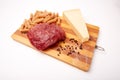 Raw Entrecote steak meat With Pepper and Salt pasta cheese On Wooden Board in a kitchen isolated on white