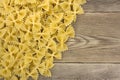 Raw farfalle pasta on the table, tasty, natural