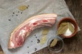 Raw fat pork belly on white paper. Royalty Free Stock Photo