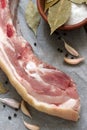 Raw fat pork belly on white paper. Royalty Free Stock Photo
