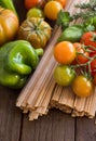 Raw fettucce pasta, vegetables and herbs Royalty Free Stock Photo