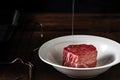 Raw filet Mignon steak in a white plate Royalty Free Stock Photo