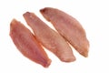 Three raw red mullet fillets close-up on a white background