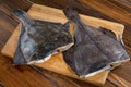 Raw fish flounder, flatfish on wood Royalty Free Stock Photo