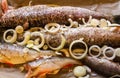 Raw fish with fresh onion and pepper ready to cook. Ingredients for cooking in a tray