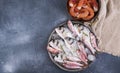 Raw fish on a gray stone background. Fresh food for dietetic food. Seafood for cooking dinner. Free space for text Royalty Free Stock Photo