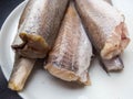 Raw fish hake isolated on white plate Royalty Free Stock Photo