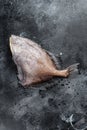 Raw fish John Dory. Black background. Top view Royalty Free Stock Photo