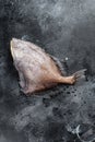 Raw fish John Dory. Black background. Top view