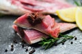 Raw fish seafood on black plate background , Longtail tuna , Eastern little tuna fillet ingredients for cooking food - fresh fish
