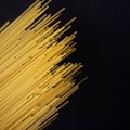 Raw flat spaghetti on black background Royalty Free Stock Photo