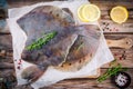 Raw flounder fish, flatfish on wooden table