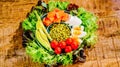 Super food.Fresh salad bowl of fresh lettuce leaves with avocado tomato, salmon and chicken egg.Raw food.healthy eating Royalty Free Stock Photo