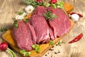 Raw, fresh beef meat with spices, seasoning ready for baking - roasting Royalty Free Stock Photo