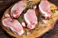 Raw Fresh Boneless Pork Chops with herbs Royalty Free Stock Photo