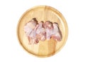 Raw fresh chicken wings on a wooden plate. isolated on white background with clipping path. Top view Royalty Free Stock Photo