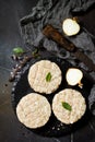 Raw fresh cutlets burger from beef for homemade burgers cooking with spices on black board.