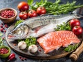 Raw fresh fish with ingredients for cooking on a dark background, top view