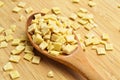 Raw fresh and healthy macaroni pasta on wooden spoon Royalty Free Stock Photo